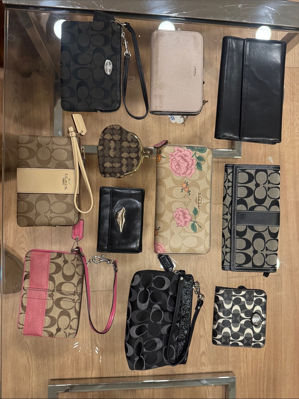 11 Coach & Assorted wristlets and wallets Lot